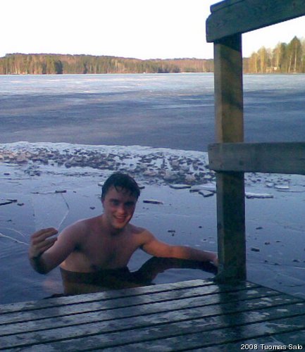 Taking a dip in an ice hole (Nasijärvi, near Tampere)